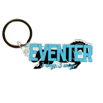 Eventer horse keychain with blue text reading “Eventer , 3 days, 3 ways” over a jumping horse background image.